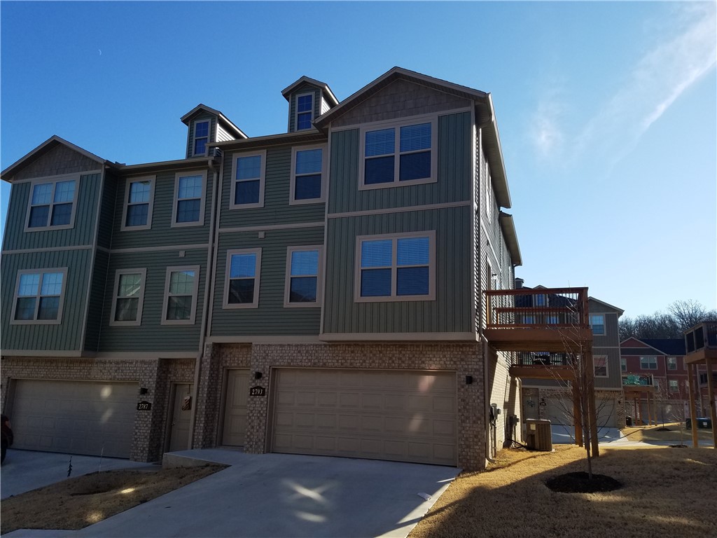 Location, location... A beautiful Town home in a desirable location. 2 Bedroom, 2.5 Baths, Washer and Dryer, 2 car garage with extra room for storage, 3 stories with an outdoor patio on the second floor. Unit is about 3 years old very light and airy atmosphere. Corner lot easy access. This will not last long!!!