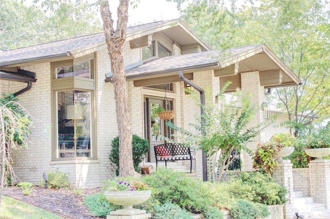 Modern, open, sprawling Fay Jones-inspired home on great lot in Summersby. Open living/dining/kitchen/lounge areas, soaring ceilings, hardwood floors, and split floor plan. Huge owners’ suite featuring dual closets w/built-ins (one 20 ft long), large office for 2 desks, private deck, and bath w/dual head shower and large jacuzzi. Guest suite w/private bath and 2 other bedrooms connected by bath. Kitchen w/marble counters, wine fridge, gas cooktop, venthood, produce sink, walk-in pantry, and wall oven. Built-ins and closets everywhere. Wet bar, gas fireplace, Anderson windows, main floor laundry, Sonos sound system, Rachio irrigation, and 3 HVAC systems w/Nest thermostats.
Large screened porch w/fans and TV, and even larger deck. 3-car garage w/storage. Huge lower level at grade with large rec room, craft area, cabinets, sink, large half bath, safe room, storage room, and large in/home gym w/walkout. New roof and gutters. Fenced yard w/irrigation.
Unique and special home designed for entertaining and living!