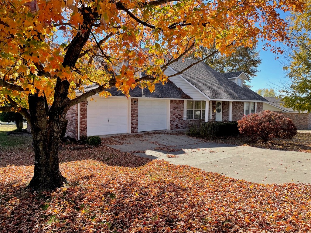 1756 square foot Brick house with an open floor plan. This home is move in ready. Living room is open to dining area and kitchen. Living room has a gas log fireplace for cold winter days. Kitchen has beautiful wood cabinets and the home includes a Sun room. 3 bedrooms, 2 baths along with a walk in closet in the master. Two car attached garage along with a large wooded deck on the back porch. Hardwood floors, carpet and vinyl in the house. This home is also located on a corner lot close to the hospital. Central heat and air.