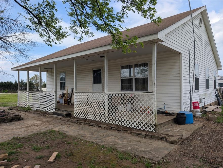 Enjoy the best of country living just a couple miles from town! This charming 2-bedroom, 1-bath home offers approximately 1,200 sq. ft. of comfortable living space, perfectly situated on around 2 acres. The property includes a barn with partial fencing—ideal for animals, hobbies, or extra storage—and plenty of flat, usable land ready for a garden, workshop, or whatever you envision. Connected to rural water for added convenience, this property makes a fantastic starter home or a peaceful place to downsize and unwind.