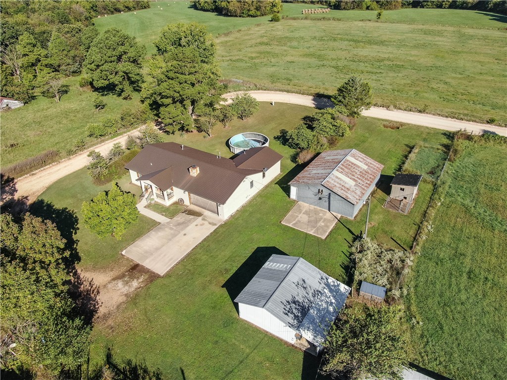 Come home to the country to your Nice totally remodeled 3 bed 2 bath with granite countes on 1.07 acres with 24X24 She shed with wood shed attahced and 30 X 40 workshop. Wood fireplace is duct thru the house to save on heating bills. Special situatiion , Day sleeper, call list agent for appointment scheduling.