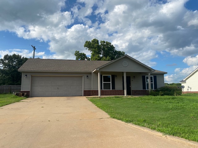 Ranch-style house with brick siding, driveway, an