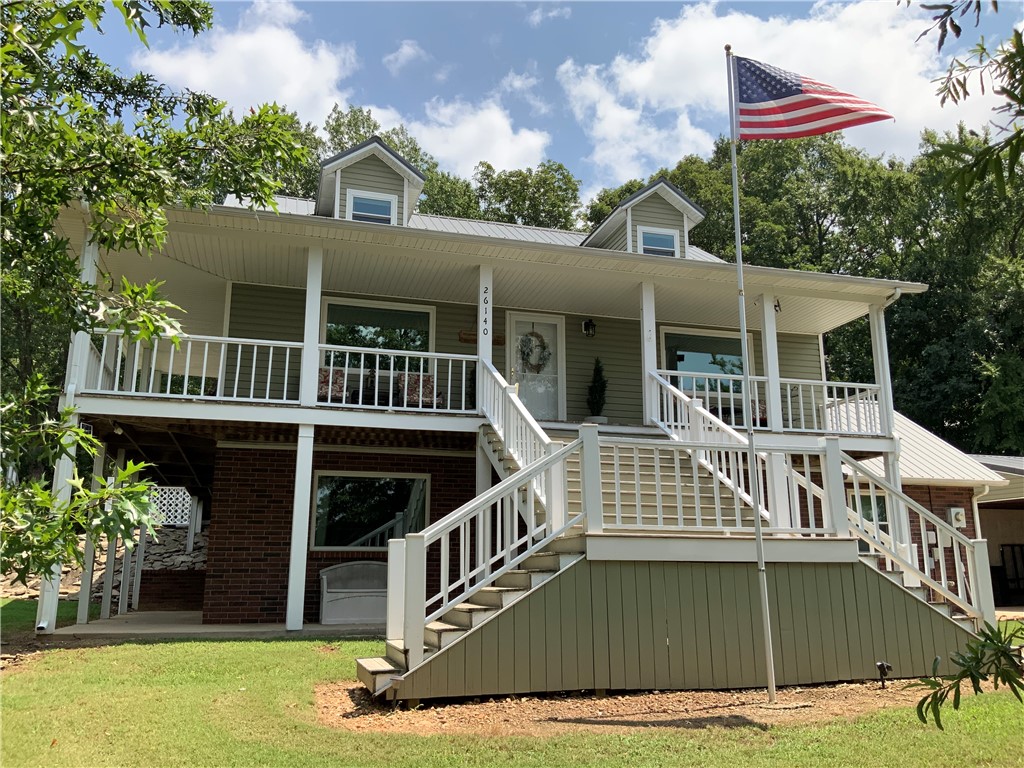 This quality built, 4br/3ba 2596sqft home on 1.37acres of well-kept grounds is nothing short of impressive! Inside, you find attention to detail with 3 stories of living in a flexible layout. A paved circle drive and carport lead to the main level, offering complete living with kitchen/dining, living room, master suite w/bath, and laundry. Upstairs boasts 2br/1ba. Head downstairs to a 2nd walk-out living area, 1br/1ba, and the 2-car garage with adjoining safe room. Wonderful use of space with custom built-ins and endless closet storage throughout. Exceptionally maintained with numerous upgrades including new HVAC. Outside, you find a nice patio area and wooded privacy, a large pond, and room to roam. Outbuildings do not disappoint with fabulous 20x40 shop, detached 20x25 2-car garage, lower carport w/storage. Peaceful country setting yet easy access to necessities. Rural water, outdoor well w/hand pump, natural gas. Far too many features and details to adequately represent this gem of a property! Airbnb potential.
