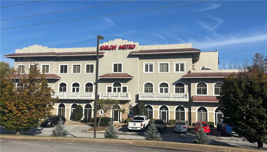 Office space with multiple executive offices, conference rooms, kitchen