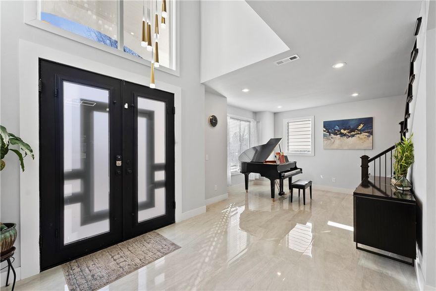 Location Location Location! 5 spacious bedrooms & 3.5 modern bathrooms. This home features luxurious lighting, granite counters, solid wood interior doors, vinyl/wood plank and glazed ceramic with a marble look flooring throughout adds a touch of elegance to this already impressive property, with ample living space. This home is perfect for entertaining and comfortable living. Don't miss the opportunity to own this beautiful property.