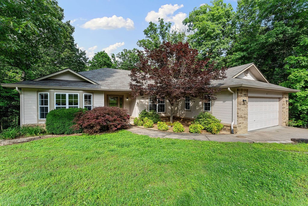 If you are looking to be walking distance from Blowing Springs Park and the Back 40 Trail, this home is made for you! The well-maintained home features 3 spacious bedrooms, and 2 full baths and the eat-in kitchen has new countertops and sparkling all-white appliances. The laundry room includes ample shelving for pantry and the third bedroom has custom removable shelving for use as an office. There is a 350 square foot room below the house that makes a great workshop or storage area. The backyard is low maintenance with abundant wildlife and trees, making it a nature lover's retreat. Welcome home!