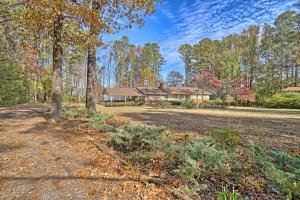 Serenity on Mockingbird Lane - A short drive outside of Dardanelle is where you will find this delightful lake front home that is filled with natural light from all rooms along with a full scale back deck for soaking in the sun and the views. Loaded with space, this 2616 SF home is perfect for your family needs with a large living room with wood burning stove, open kitchen and dining area. Down the hall you will find all three bedrooms along with two full bathrooms - the master nestled in the back to take full advantage of the sun porch with its own private door - Perfect for your morning ''wake up'' call! When it's your turn to host the family gatherings, no worries here! The downstairs offers so many opportunities and so much room! Game night, sleepovers, parties, no problems!