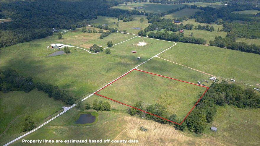 Rare opportunity to own 5(+/-) acres of buildable land in the highly sought after East Fayetteville! This flat, usable parcel offers flexibility for barndominiums, tiny homes, homesteads, or hobby farming. Enjoy modern connectivity with OzarkGo fiber optic internet and electricity at the road. Water access currently requires a well, with city water anticipated within 1–2 years. The property has no pesticides or herbicides applied for 3+ years, making it eligible for USDA Organic certification (buyer to verify requirements). Located just minutes from downtown Fayetteville, Lake Sequoyah recreation, and I 49, this land combines privacy, convenience, and long-term investment potential. Financing options include USDA Rural Development loans, conventional, and land loans.