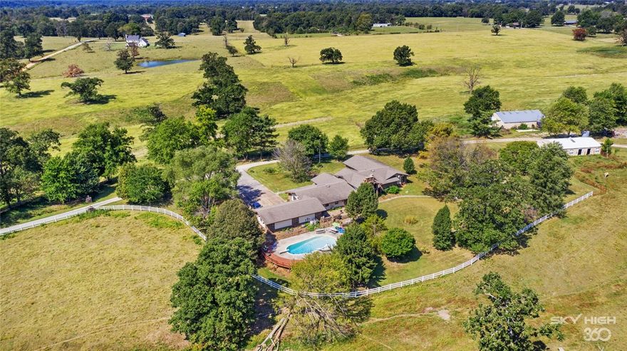 An established homestead on 147 rolling acres, once a working farm, now a prairie and pasture land, a 5 acre lake and fresh water spring are rare and beautiful to find. This 1973 prairie ranch style house is situated on wide opens space. It is conveniently located acreage as it is only 5 minutes from the new Bella Vista Bypass, 15 minutes to Bentonville and less than 10 minutes to I-49 with multiple access points from the property surrounded by road frontage. Seller will not divide. The listing agent must set up showing appointments and potential buyers must have proof of funds before setting up a showing/per sellers instructions.