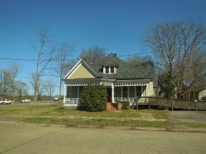 Large house for the money. River front property, two story historical home located in the heart of old town Dardanelle. Lots of possibilities for this property from comfortable living quarters to commercial office space. Very, very high visibility at the foot of the Arkansas River bridge. Needs some repairs.