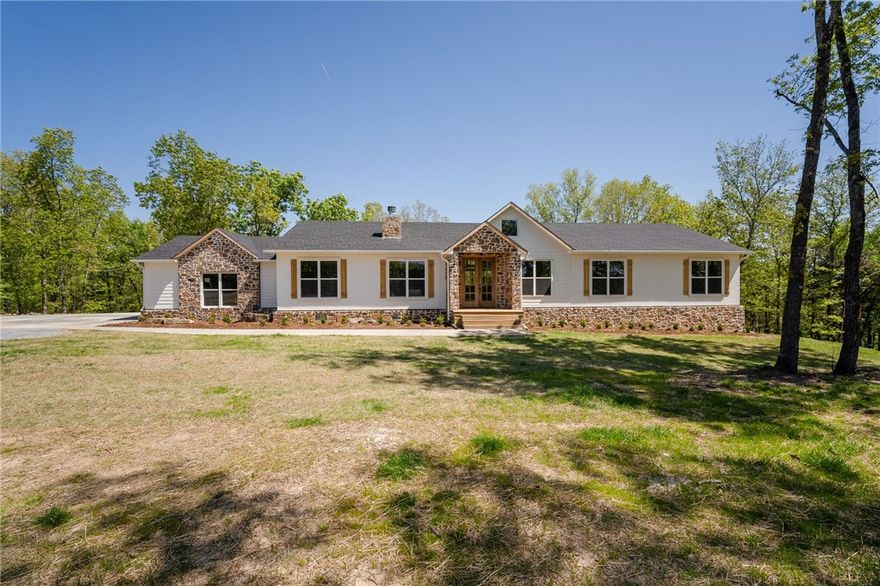 Newly constructed European Farmhouse on 33 secluded acres with a guest home! The main home has 5,050 heated and cooled sq ft and is highly energy efficient due to it being an ICF-constructed home. The main home has 5 bedrooms, 4.5 baths, 4 living rooms, an office, a media room, a gymnastics room, an attached root cellar, a covered balcony with mountain views, a covered porch, and an additional 1,080 sq ft shop located in the basement. The guest home has 1,500 sq ft, 3 beds, 1.5 baths that sleeps 9 people that is currently being used as an Airbnb. The business is growing rapidly and has the potential to pay for the entire property. The home would also make a great guest house, mother-in-law quarters, or house for an additional family. The 33 acres are secluded in the hills of the Ozarks yet only 10 miles from town. The acreage includes 1,600 ft of Sherman creek frontage, 4 acres of cleared property, a water well for irrigating gardening and farm animals, and 29 acres of woods to watch wildlife.