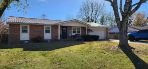 Newer windows, HVAC, roof, tubs and walk in shower installed in 2012. New water heater in 2022. Large living room and dining room, fireplace, sunroom and privacy fence. Conveniently located on the north end of town.