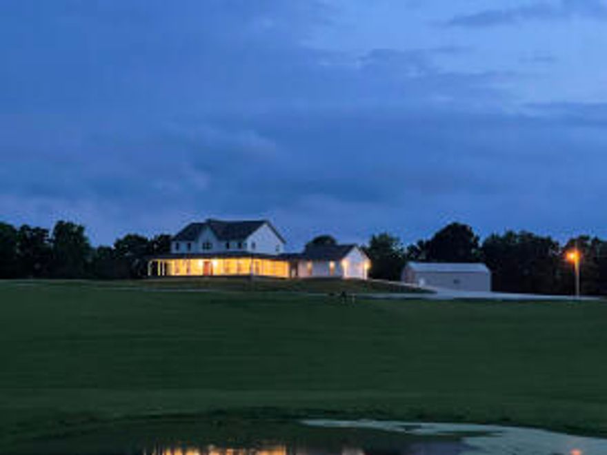 Pending accepting back up offers. This beautiful 6 BR 4 & 1/2 BA farmhouse on 36 manicured acres deserves your attention! 3 levels offer living room with gas log fireplace on main floor, huge family room with kitchenette in basement, and loft with room to gather and socialize upstairs. MBR on main floor with another MBR upstairs. Kitchenette in walkout basement provides for the option of separate living quarters.  Wrap around porch with breezeway to 2 car garage. 30' X 40' Shop building with electric, water and bath. Pretty acreage with views is mostly open with 3 ponds. Property fronts a county road and is minutes from Harrison and approx. 45 minutes to Branson, MO, Bull Shoals and Table Rock Lakes, and White River. 25 minutes to Buffalo National River.