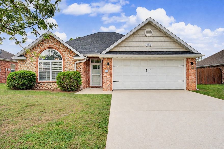 Move-in ready and  exceptionally maintained, this home is a great opportunity in Northwest Arkansas! This home is conveniently located 5 minutes from Bayyari Park and Mountain Bike Trails AND less than 10 minutes to both downtown Springdale and Lowell! It's open floor plan features durable wood-look tile through the living room, kitchen, and dining area, while plenty of windows bring in natural light. Vaulted ceilings highlight the primary bedroom, along with a nice ensuite bathroom and walk-in closet. One secondary bedroom includes a vaulted ceiling and large window, while another features a custom accent wall. Just off the dining area, a covered pergola creates a comfortable outdoor space overlooking the shaded, fenced backyard. The shed conveys providing outdoor storage.  Updates include new roof 2022, freshly painted interior trim, new windows in primary bedroom, middle bedroom and living room, new siding on the back of the home, and new front door.