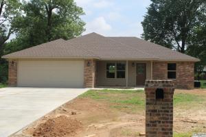 This beautiful new construction would make the perfect home. It sits on 2 lots on a dead end street perfect for kids to have room to run and play. The house is located in the heart of Atkins. This 3 bedroom 2 bath is ideal with a split floor plan. The large laundry room as you enter from the garage is complete with a stainless sink and extra cabinets and storage space.