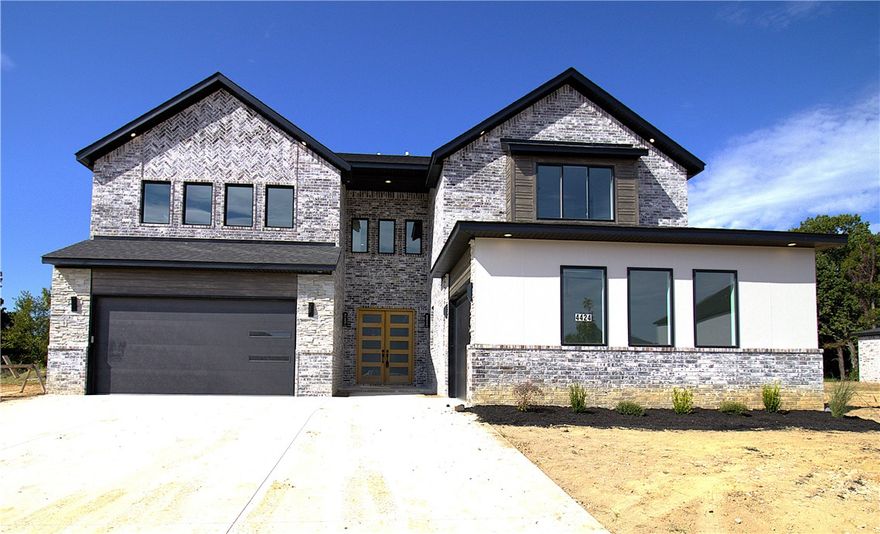 The long search for your dream home has come to an end! This stunning contemporary home currently being constructed in the Soaring at Scissor Tail subdivision is the perfect home. Enjoy the spacious entryway with wooden floors, as large windows flood the space with natural light that highlights the houses’ sleek, contemporary kitchen serving as the heart of the home. The kitchen contains a gas cooktop, an oversized quartz island, custom cabinets, and a walk-in pantry. The living space contains 20 foot ceilings, top-quality finishes & impeccable design throughout with a linear fireplace, surround sound wiring etc.The beautiful amenities follow to the master suite containing an accent wall, double floating vanities, a corner tub, custom-tile shower, and a spacious walk-in closet. On the second floor there is a large game room, wet bar, extra bedrooms, and a theatre room that gives you all the space to enjoy and relax in the home of your dreams featuring many beautiful and unbelievable upgrade options.