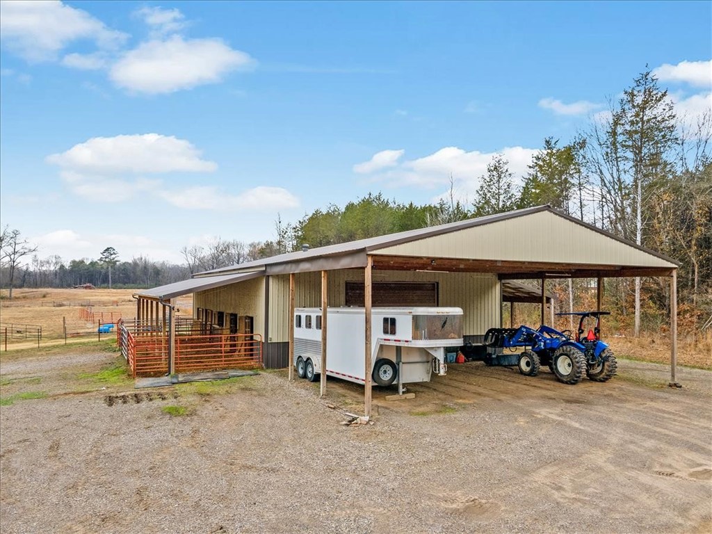 21+/- acres in the ideal location and ready for horses or livestock. Property has large barn with stalls and tack room plus large overhangs on the front and side to park your tractors and equipment. Barn has a concrete floor and wash rack. Property is mostly flat and is fenced on four sides with an internal fenced area as well. This property is close to Van Buren and Alma and a short drive down from NWA. Build your dream home. additional property can be purchased as well.