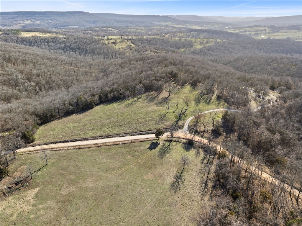 Expansive views, ready-to-build convenience, and no restrictions āthis 105.28-acre property in Boone County truly has UNLIMITED potential! Not only are there multiple building locations, with 180-degree views, that have already been perc tested, but there is electricity, water, and a newly installed septic system already on site. There are two prepped gravel pads in front of a large pond - one pad is set up for a camper hook-up, and the second is designed for a cabin to be built on it with blueprints ready! In addition to the large pond, there's a live creek that attracts wildlife of all kinds. Being in the heart of the Ozarks, the rolling landscape offers a great mix of openness and wooded privacy. Not to mention, it's located less than a mile off of US-412, and only 10 miles back to Boone County's main hub, giving you a blend of privacy and accessibility. Whether you're looking for a hunting retreat, to build your dream home, or a weekend escape, this land is ready for you! Schedule a private showing today!