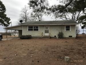Charming vintage home located in small community just a few miles from Walmart, medical and schools. Home features 936 sq ft with 2 bedrooms, 1 bath and an attached carport. Property sold as is where is. ***PROPERTY IS NOW UNDER AUCTION TERMS. PLEASE SEE WWW.REALTYBID.COM FOR TERMS AND CONDITIONS, TO SUBMIT BID AND TO REGISTER BUYER.