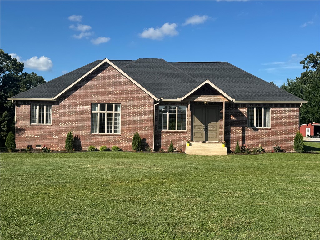Beautiful home with gourmet kitchen, hardwood floors and high ceilings! Home is set off the road on a small 10+ acre ranch, perfect for horses or cattle. Private and quiet setting in the country. Perfect get away from the hustle of the city but a super short drive to get on the interstate, which makes you close to everything. Property has a large very nice pole barn for implements and farm related items, also has fencing and a corral. The three car garage is close to the house for ease of parking. Also has another outbuilding for storage. If you’re looking for a modern home in a quiet country setting, this is the perfect location for you!