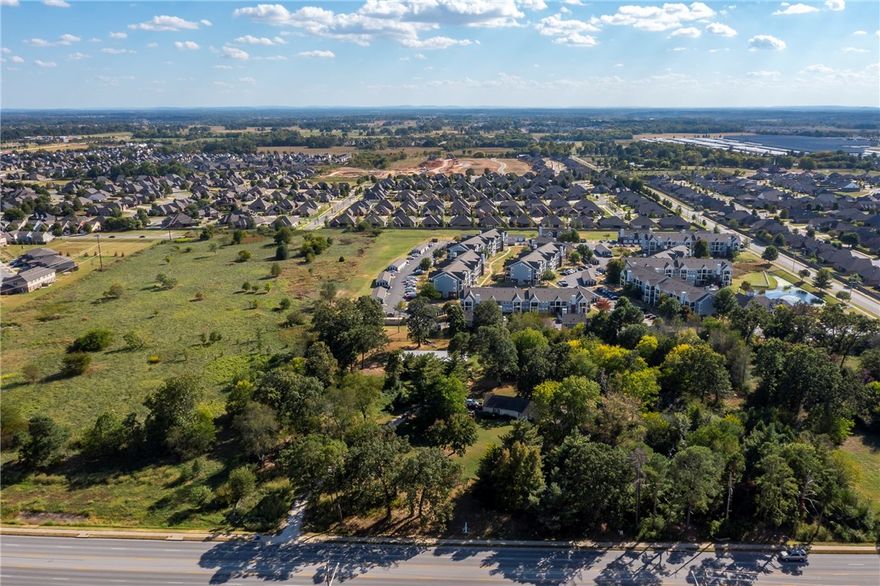 COMMERCIAL / DEVELOPMENT OPPORTUNITY 4.61 Acres  474' of Frontage on SW Regional Airport Blvd. 
XNA Airport right around the corner.  3.5 Miles to I-49.  Two Structures on the property House 2258 sq ft. another 2,400 sq. ft. shop building.  This property great for any kind of development. 5 Lane Hwy with High traffic count. Exceptional Location for Retail or Professional offie space in Bentonville.
