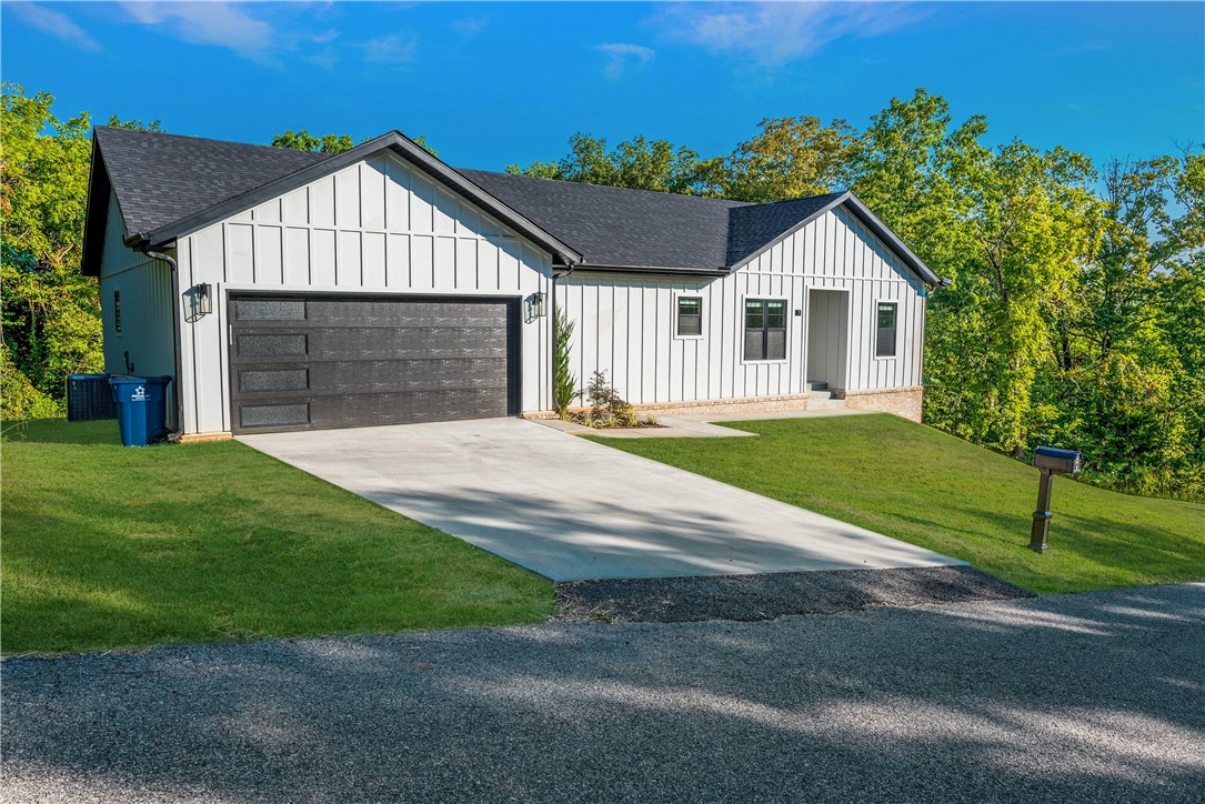Nearly new home (built 2023) in an excellent Bella Vista Location. From Hamilton Drive, you can quickly get onto the I49 and gain easy access to much of Bentonville. Short distance to Walton Blvd in North Bentonville. Located on a very secluded lot with views of the forest out the windows. Concessions available for tile shower upgrade in master bathroom, inquire for more info. *Photos are digitally staged to show what the space can look like.