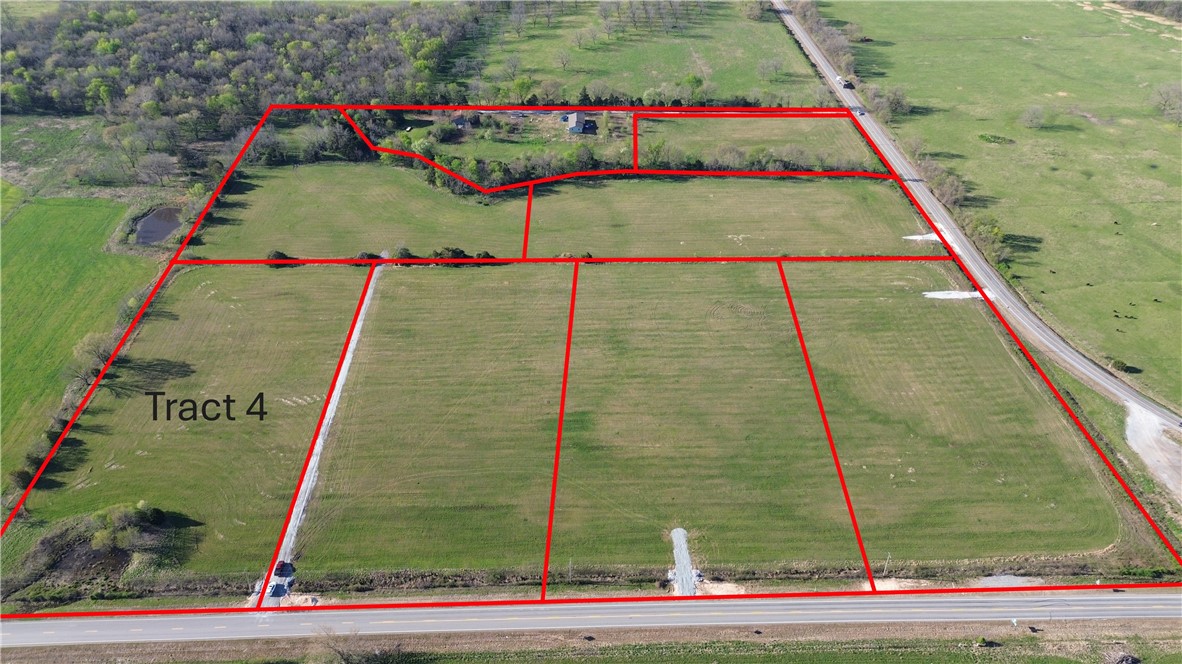 Tract 4 is located at the corner on HWY 102 in western Benton County. Upon finalization of the survey/plat, Tract 4 will be 5.6 m/l acres. Lcoated off of paved road with electric and rural water at the street, this tract provides an excellent opportunity to live in the country but have convienent access to Gravette, Decaturm Siloam Springs and the rest of NWA.