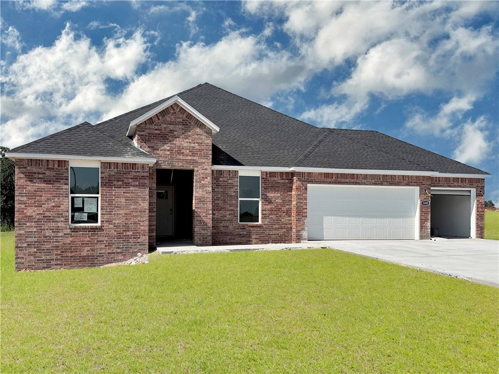 Gorgeous Garland plan with a 3-car garage in Monitor Meadows, where you'll experience modern luxury in Lowell, Arkansas. Our meticulously crafted floor plans provide ample space for you to grow and thrive. Beautiful Quartz countertops in the kitchen with tile backsplash and 42-inch upper cabinets. Oversized island per plan. Black plumbing fixtures throughout! LED lighting throughout! Ceiling fan in the living room and bedrooms! Living room will have and a modern electric fireplace with a poplar mantle. Bedroom 1 has a fabulous ensuite with an oversized walk-in shower with tiled walls, elongated commode and quartz countertops with dual sinks. Back door is a full lite glass with mini blinds. Approximately 1 acre lots!!