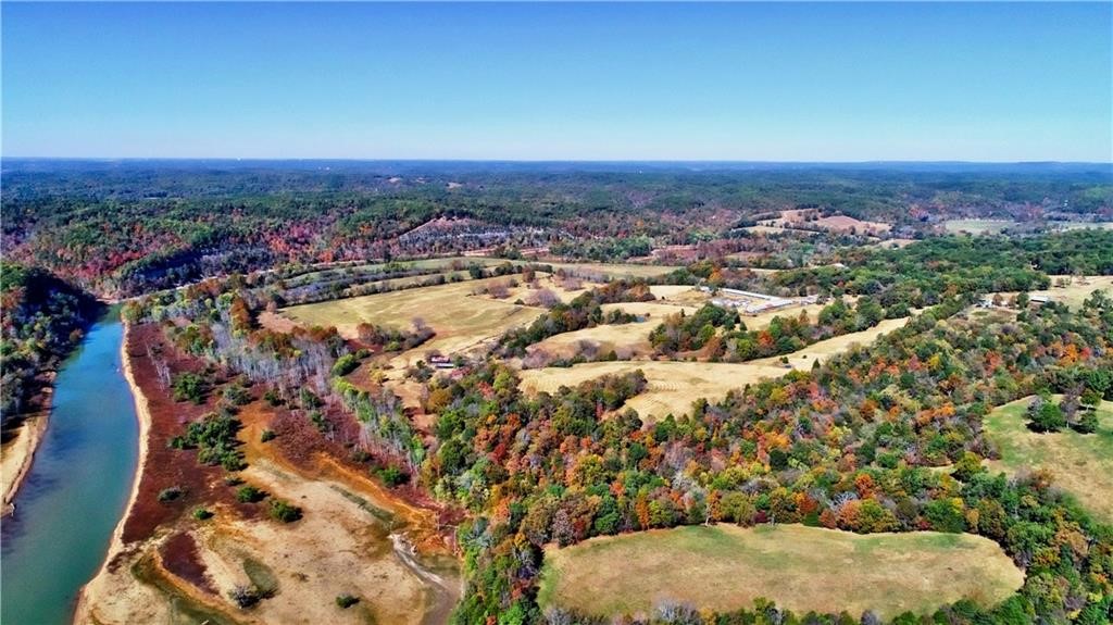 Beautiful 122 acres +/- Generational Family Farm/Ranch. 98 +/- acres Mowable/Grazable mixed grass pastures. 24 +/- acres mixed hardwoods including mature walnut and oak trees. Fenced and cross fenced. 3 ponds. 2H2O wells, adjoins us ace Beaver Lake, War Eagle Arm in area locally known as Peter Bottom. Adjoins old oxbow lake adjacent to War Eagle River. Public water available at entrance gate. Location 1.8 miles to War Eagle Mill. 2.3 miles to Hobbs State Park Visitors Center. Hobbs State Park 12.054 acres; horse back riding, hiking & mountain biking, trails and shooting range. Also see MLS 1265928 & 1265931.