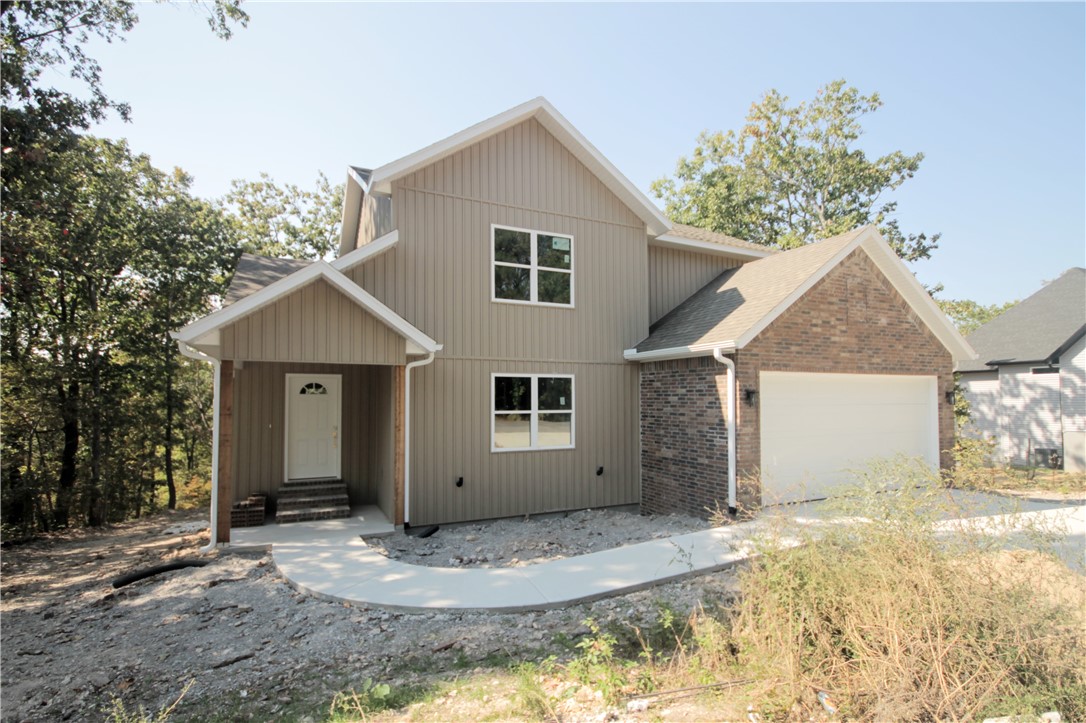 Gorgeous new construction home nestled in Bella Vista. Centrally located minutes from shopping,
restaurants, and schools. Bentonville schools! Bike from your front door to the Back 40 Trail Head down the street! Great home with fantastic layout, tray
ceilings throughout and large rooms. Secondary bedroom on the main level. Large living room with
beautiful gas fireplace, open floorplan and views of the mature trees. Kitchen has custom wood beam with vaulted ceiling, granite countertops, stainless steel appliances, large eat-in kitchen area and pantry. Large master bedroom with spa like master bathroom has double sinks, soaking tub, walk-in tile shower and large walk-in closet. Secondary bedroom on the second floor and large bonus room for all your needs! Covered deck overlooking the backyard and all the beautiful mature trees!