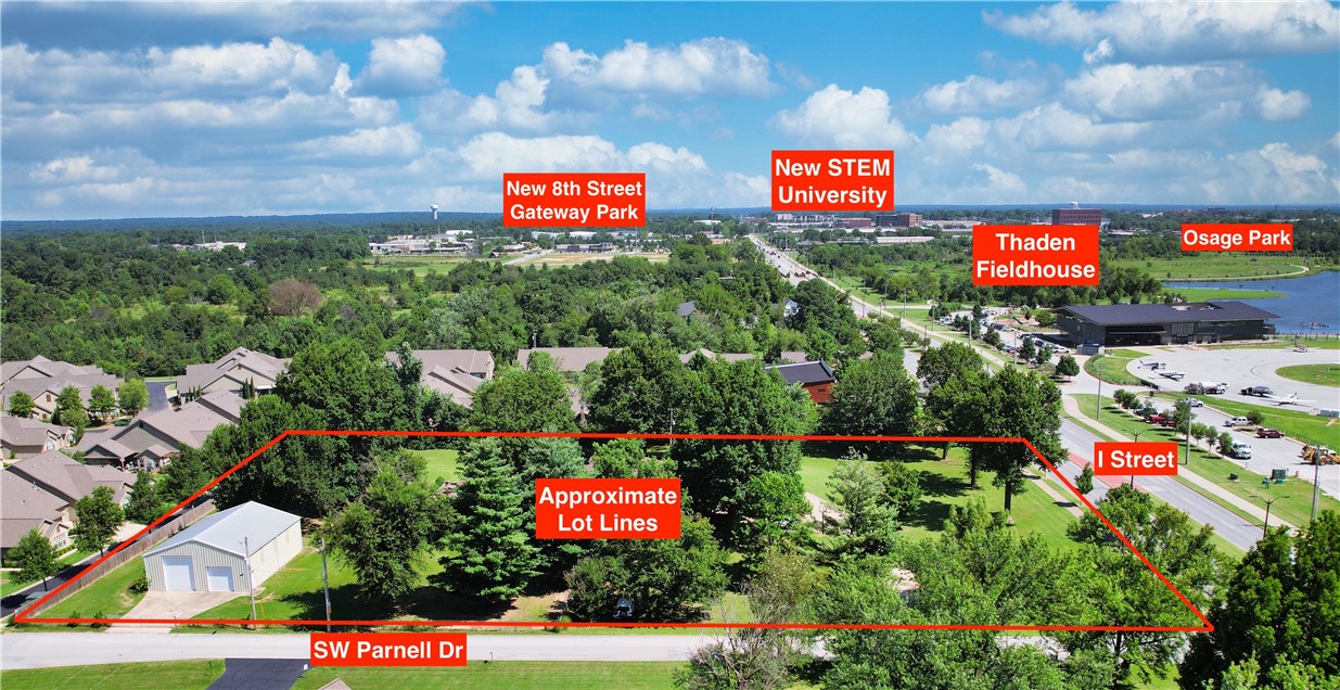 Exceptional development opportunity in the heart of Bentonville! This 3.1 +/- acre corner lot is ideally situated on SW I Street—directly across from Thaden Fieldhouse and just minutes from the new Walmart Home Office and the highly anticipated STEM School. With future zoning for commercial use and approximately 17,000 vehicles passing by daily, this property offers unmatched visibility and potential. The property currently features a residential structure with a pool and 40 x 50 shop building, but the true value lies in its prime location and future development possibilities. Positioned on a rare corner lot, this site provides excellent access and frontage on I Street, which is slated to connect directly to the new Hwy 612 Bypass. Whether you're looking to build a commercial center, mixed-use project, or capitalize on the area's rapid growth, this property is a rare find in one of Northwest Arkansas’ fastest-growing corridors. This property is also listed as Commercial – see MLS#1316083. Property sold “as is”.