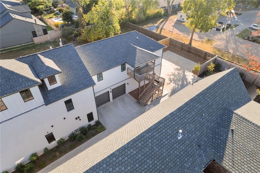 Multigenerational living or nanny's quarters in this gorgeous Brownstone located just 2 blocks from the renowned Bentonville Square and is surrounded by award-winning restaurants, mountain bike trails, and shopping. Rarely do these come available so now is your chance to live the Downtown Bentonville lifestyle. The main home offers 4 bedrooms, 3.5 baths, an office space, and a bonus space. In addition to the main is a separate residence at the back of the property with a private entrance.  The ADU is a full 2 bedroom apartment fully equipped with kitchen, laundry, etc.  The best part about this home is the oversized FOUR car garages plus additional parking in the back for your guests! This is unheard of for DT Bentonville. Schedule your showing today to see what makes this home so very special. Main home is 3718 sq ft and the guest quarters is 1263 sq ft.