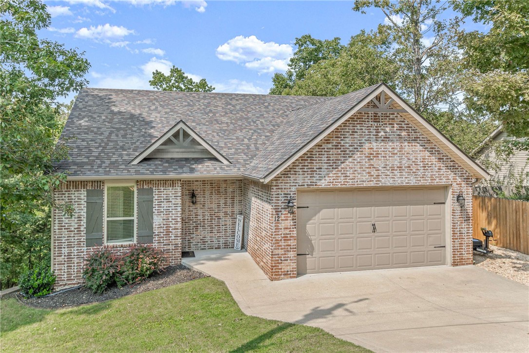 Located in the peaceful Rivercliff Village neighborhood on Beaver Lake, a favorite feature is the high, spacious deck overlooking the trees in back. With an almost treehouse feel, you will enjoy
sipping your evening away under the ambience of string lights or relaxing in the cool mornings. With matching lower deck, there is plenty of room to grill out, soak in a hot tub or relax and watch the
deer and other wildlife that roam the neighborhood. The level gravel area in the back is perfect for a fire pit.
The main floor includes a large dining area, kitchen with island, breakfast nook, desk area, laundry room, half bathroom and primary bedroom with ensuite bathroom featuring a walk-in tiled shower and jetted tub. Downstairs boasts two more bedrooms, a full bathroom, family room with wet bar and access to the lower deck. Neighborhood amenities include a nature trail and lake access to a quiet cove.
Option to purchase this home beautifully decorated and fully furnished (including hot tub) for an additional cost.
