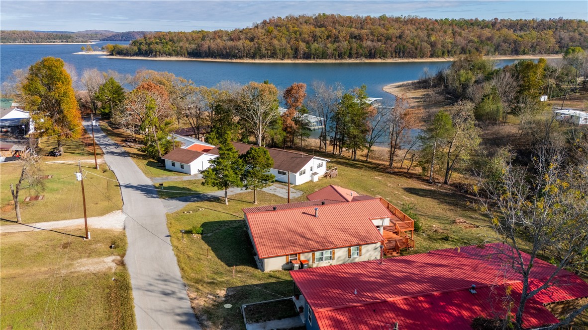 Hereās your chance to create your dream lakefront property! This fixer-upper sits on a prime lakefront lot with easy water access and stunning views from the deck. The house itself is a shell that has been added onto over the years and is currently gutted, offering a blank canvas for your vision. With a boat slip in the community dock (complete with a lift), youāll have convenient access to the lake just steps away. The property is located just around the bend from Rocky Branch Marina, and thereās a boat launch right down the street. Boat slip is approx 20ft long and is an end slip with end dock next to it. While the house likely needs to be replaced, the location is unbeatable for those wanting lakefront living. Reach out for more details and to explore the potential of this unique property.