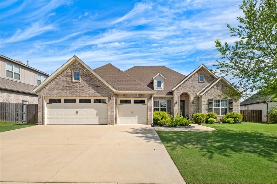 Discover effortless luxury in this beautifully designed one-level home featuring 4 bedrooms, 3 baths, and a thoughtfully designed split floorplan. The open-concept living, kitchen, and dining spaces create the perfect setting for everyday living and entertaining. The gourmet kitchen offers stainless steel appliances, a farmhouse sink, oversized island, and abundant prep and gathering space. Escape to the private primary suite tucked away for comfort and relaxation, while a dedicated office provides flexibility for work or study. Step outside to the covered back porch overlooking the backyard complete with a custom putting green—designed for entertaining and enjoying outdoor living year-round.
