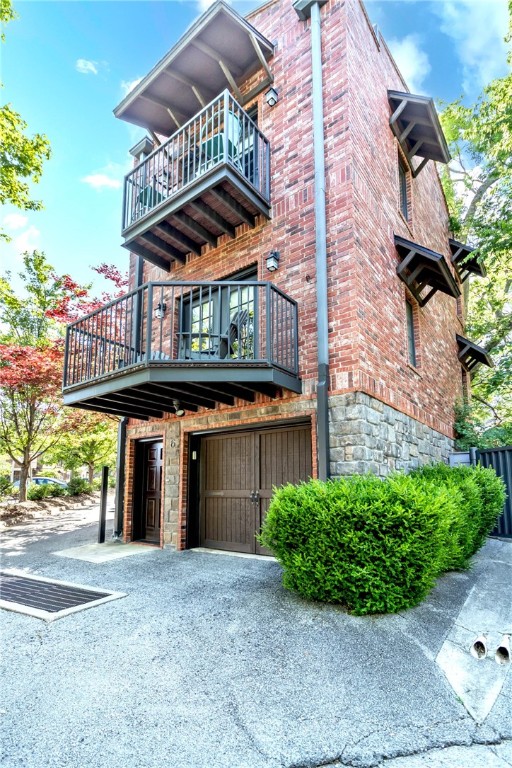 Location, Location, Location! Located directly behind Farrell's Lounge, just a parking lot away from the Walton Arts Center, the Dickson Street Pub, and Dickson Street Liquor, this 2 bedroom, 1.5 bath, townhome is on the West end of the 6 unit development, has parking, storage and a fenced yard on the first level, an open kitchen/dining/living and half bath on the second level, 2 bedrooms and a full bath on the third level with views from every window, in every direction, and three balconies to boot. Most furniture, all appliances, and some furnishings can convey with an acceptable offer. This property is turnkey, and ready to be your Fayetteville home away from home. Don't delay! Come see this property today! Before it's gone!