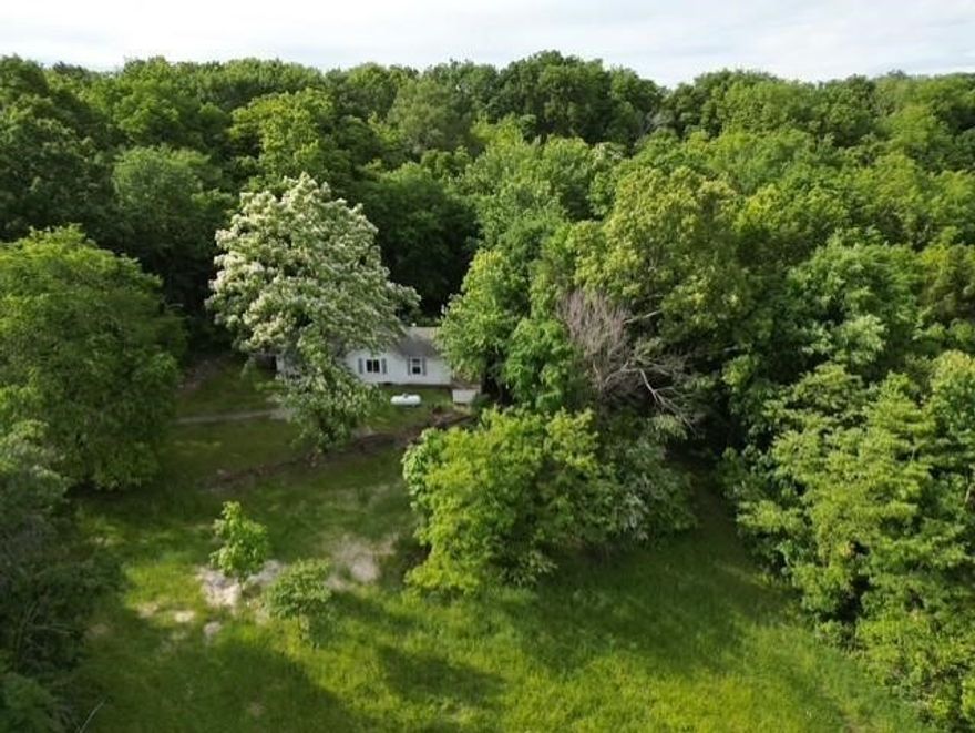 Discover the potential of this beautiful 6-acre property, perfectly tucked just off the highway for easy access while maintaining a peaceful, private feel. Mostly wooded with mature trees, this land offers a serene natural setting and multiple potential building sites ideal for your dream home or investment opportunity. Whether you're looking for a place to build, explore, or invest, this property brings together location, character, and versatility in one scenic package.