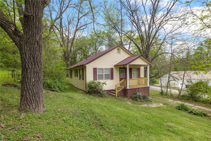 This move-in ready 2-bedroom, 1-bath home offers 720 square feet of comfortable living with fresh updates throughout. New floor coverings, freshly painted interiors, and a fully updated bathroom create a clean, new feel. A durable metal roof adds long-lasting value. The home sits on a generous double corner lot filled with mature trees that provide shade and a sense of privacy. Perfect for first-time buyers or as a low-maintenance investment, this updated residence is ready for its next chapter. Agent/Owner.