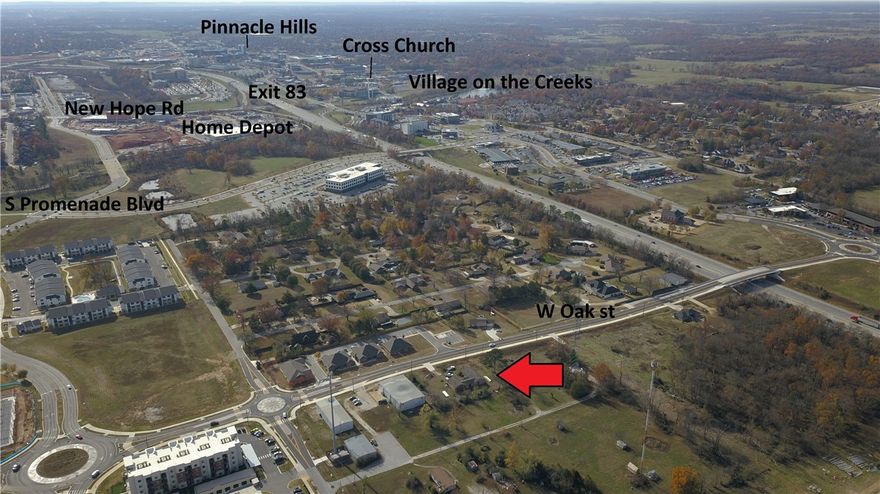 This property boasts endless opportunities in a prime location. Townhomes, apartments, office, health care, entertainment can go as high as 6 stories. Just minutes to Pinnacle Hills Mall, I-49, Mercy Hospital and Walmart Home Office. Property has a 1928 SF unfinished house and 2 car garage. Don’t let this investment opportunity pass you by. Approximate 206' of road frontage. Can go 5.1, 5.2, 5.3 up to 6.1 zoning.
