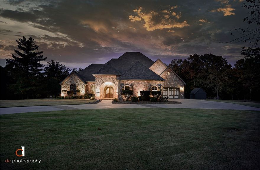 EXECUTIVE ESTATE ON 5+ ACRES! Recently remodeled & professionally designed. Beautiful Indoor & Outdoor living spaces! Foyer has gorgeous staircase & breathtaking light feature. Living Room has custom built entertainment center & bar w/ 2 beverage coolers. Chef’s Kitchen w/ updated appliances & dining space. Oversized master w/ exercise rm & reinforced walls in master closet as storm shelter. Large bedroom #2 on main level is wheelchair accessible. 2 Bedrooms & Bonus Room on upper level with balcony. Each bedroom is a suite. 2 fireplaces (living rm + office). Easy access to downtown Bentonville, I49, & bike trails.