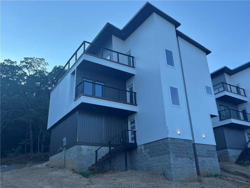 This stunning new construction in South Fayetteville combines modern
design with an unbeatable location near trails, schools, and more. Enjoy
breathtaking rooftop views from the terraces, a two-car garage with
frosted glass doors, and a custom landscaped front yard. The open floor
plan features hand-scraped hardwood floors, a gas fireplace, and a
beautifully designed kitchen with granite countertops, stainless steel
appliances, and a built-in pantry. The master suite offers built-in
cabinets, a serene bathroom with a walk-in shower and double vanity,
and a spacious walk-in closet. Guest bedrooms feature hand scraped wood floors as well, and
the home is complete with laundry hookups and thoughtful finishes
throughout. Don’t miss out on this one-of-a-kind home! Approved borrowers will receive a closing cost credit of 1% of the loan amount up to $5,000 on their Closing Disclosure on their loan closing with Envoy Mortgage Branch NMLS #2659248 and Branch NMLS #2579798