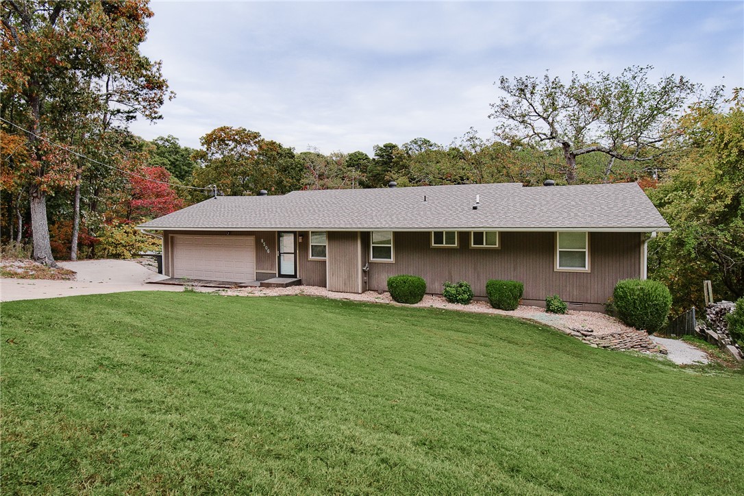 Peaceful quiet setting as you relax on the deck and enjoy the beauty. Home has many updates and ready for new owners! Just 5 minutes from boat launch at Beaver Lake. This home would make a wonder Airbnb, rental or entertaining home! The lot is great with big beautiful trees.