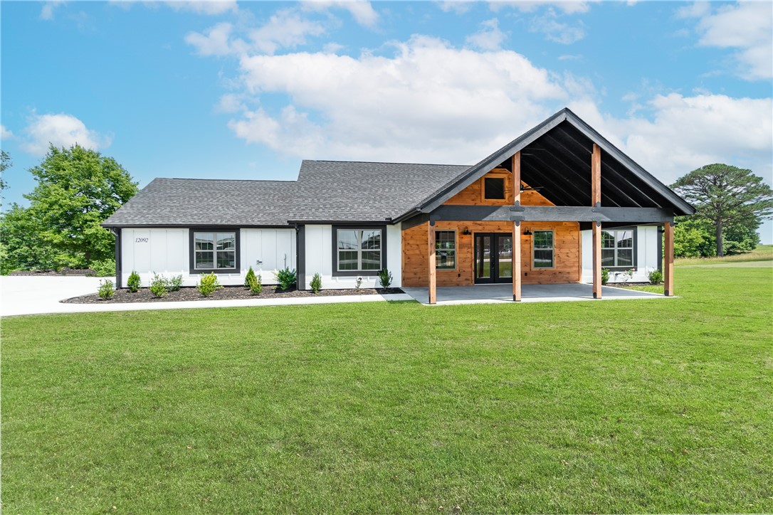 Welcome to the perfect combination of luxury and convenience! This newly constructed, split-floor plan cabin home is nestled in a quiet 1-acre lot on Guyll Ridge Road in Benton County - recently named the best place to live in Arkansas. Step inside to 15-foot high ceilings and an electric log fireplace that will make you never want to leave. The luxury vinyl plank flooring throughout adds a touch of elegance, while the ceramic tile provides functionality and style. Enjoy two outdoor living spaces: a covered front porch for relaxing with family or friends, and a back deck for hosting barbecues or taking in stunning views of the countryside. With no POA restrictions, ample parking space from the two-car garage with side entry and oversized driveway, plus high quality finishes ā this rare new build offers unbeatable value.