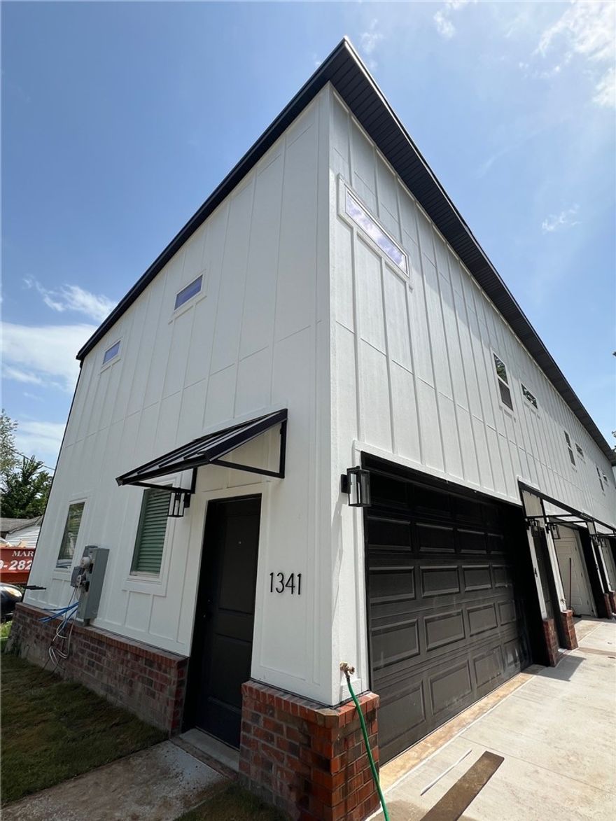 Nice newer modern townhomes near U of A campus! Home features 1 bedroom, 1 full bathroom, 2 car garage, LVP throughout, granite countertops, ss appliances, large tiled shower, & all appliances included. Come take a look.