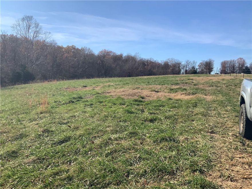 OWNER FINANCING AVAIABLE on this beautiful property in a prime location! 19.44 rolling, partially wooded acres, with 2 springs that were developed in the past. Tract is surveyed with paved road access, 2 miles off of Hwy. 412. All amenities nearby and a short 25 minute drive to the Springdale/Fayetteville area. Enjoy country living with city convenience. Great place to build your forever home. No commercial poultry or swine and no mobile/manufactured homes. Utility availability is the responsibility of the buyer or buyers agent.
