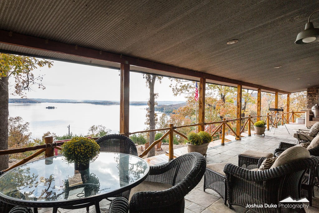 INCREDIBLE sweeping lake view cabin/house w/private 2 slip dock with lifts & swimdeck! Very private on the best part of the lake. 5 parcels, 5.56 ac. 4 beds 3 baths including a huge 6 bed bunk room. Sleeps up to 16. 2800 sq ft. 800 sq ft covered porch. 420 sq ft screened porch, both facing incredible water view sunsets. 3 fireplaces - living rm., family rm. and screened porch. New remodel inside and out. New: HVAC, hot water heater, granite/quartz counters, electric box; in & out paint, roof 5 years old. Water views on both north and south side. Two beautiful lighted picnic areas. Wired for hot tub outside with beautiful lake views. Outside fire pit area with cedar benches. Roofed "sleep in" (2 person) cooled treehouse with great views. Perfect for home, 2nd home or vacation rental. Has been rented for $475/night on VRBO. Furniture, boats, jet ski, dock accessories negotiable. Property off of paved state and county maintained roads. Professionally decorated.