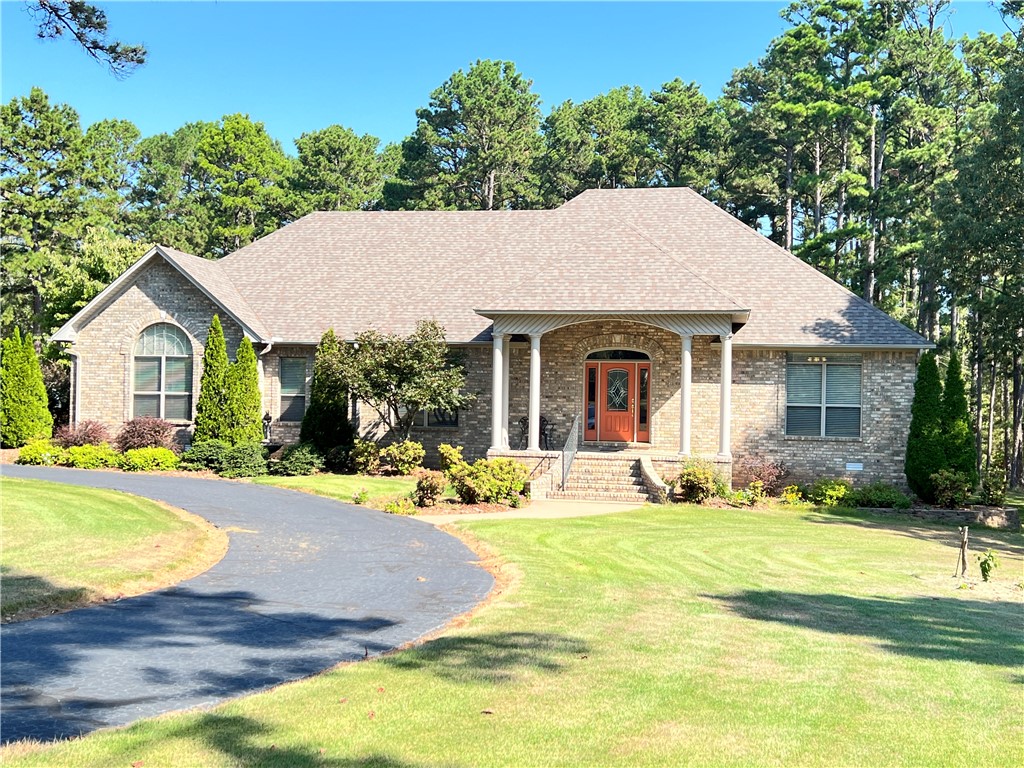 If you are hoping to find a maintenance free home in Pottsville School District, take a look at this home on a landscaped 1.5-acre lot in Cliff & Stream. Asphalt circle drive that circles to double garage and rv garage, a collection of natural dogwoods and added azaleas completes the exterior view. Inside find great floor plan, totally livable for whatever your lifestyle, with split floorplan for 3 large bedrooms and 2 full baths. The covered deck on back has great view of wooded area and is completely private on all sides. Kitchen features eat in bar area, island, walk in pantry, pull-out shelving in cabinets--refrigerator and washer and dryer remain with home. Private laundry room with separate sink. Double garage is oversized with room for large car and truck, separate door to deck. Floored storage area over master bedroom, don't forget to look at the full-size door that leads to concrete floored storage under house, completely shelved, and with great view of the construction of underside of home
