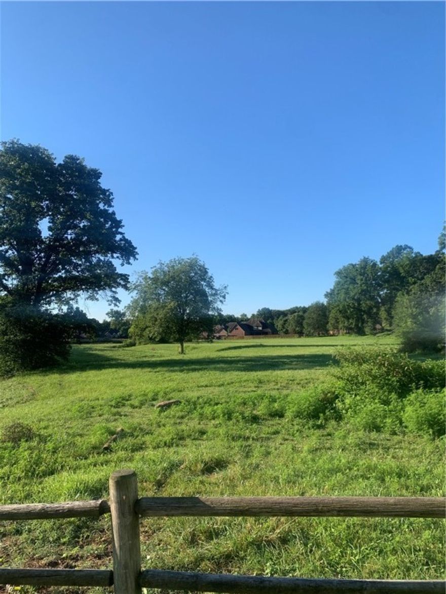 Discover the perfect blend of country tranquility and city convenience with this beautiful 5.8-acre flat pasture property. Located just 3.1 miles from the Walmart AMP, 3.4 miles from Pinnacle Promenade, 3 miles from I-49, 5.5 miles from the Bentonville Square, and only 8.5 miles from XNA Airport, this land offers peaceful rural living with unbeatable access to all that Northwest Arkansas has to offer.  With open, level terrain and scenic surroundings, the possibilities are endless—build your dream home, start a hobby farm, or simply invest in one of the fastest-growing regions in the state. Enjoy the privacy of country life without sacrificing the convenience of nearby dining, shopping, schools, and entertainment.  Don’t miss this rare opportunity to own acreage in a prime location just minutes from the heart of Bentonville!