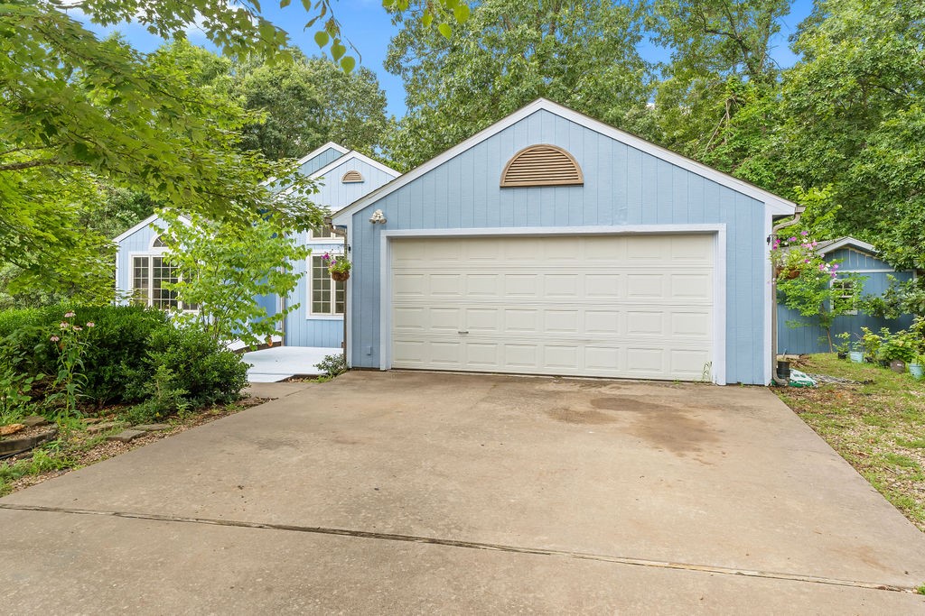 Welcome to this delightful two-bedroom home featuring a versatile bonus room perfect for an office, hobby space, or guest area. Enjoy the warmth and character of the dedicated dining area and an inviting eat-in kitchen. Step outside to the covered back deck, semi-enclosed for added comfort and offering endless potential for relaxing or entertaining.
The beautiful cottage garden creates a welcoming first impression, complemented by a wheelchair-accessible ramp to the front door. Nestled on a quiet cul-de-sac near Branchwood, with easy access to serene lakes and golf courses. This home offers a wonderful opportunity to add your personal touch and make it your own.