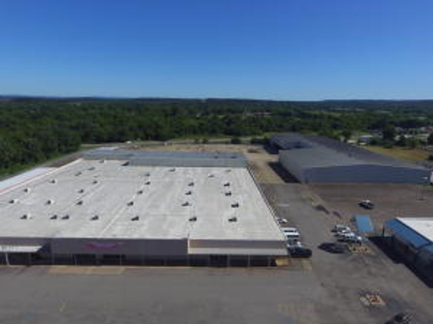 110,000+/- sqft commercial buildings spreading out over an 8 acre lot. Lying in the center of Russellville's major retail and industry side of town is a vanilla box of endless possibilities. Located between 2 high volume traffic areas.  Former location to Wal Mart and National Home Center.